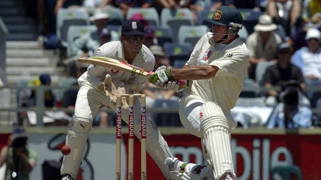 Matthew Hayden sweeps past Geraint Jones .