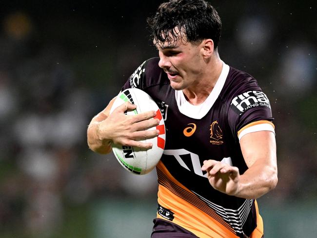 SUNSHINE COAST, AUSTRALIA - FEBRUARY 12: Herbie Farnworth of the Broncos attempts to break free from the defence during the NRL Trial Match between the Brisbane Broncos and Gold Coast Titans at Sunshine Coast Stadium on February 12, 2023 in Sunshine Coast, Australia. (Photo by Bradley Kanaris/Getty Images)