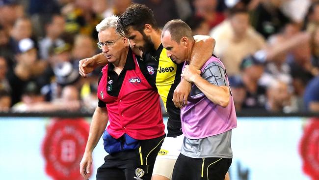 Alex Rance is helped off the field in Round 1 after suffering an ACL injury. Picture: Getty Images