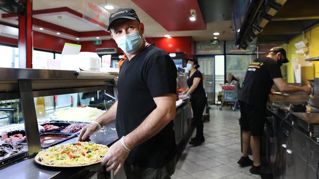 Allen Aydem, front, and Gulden Yildirim tend to a trickle of customers at Tommy’s Kebabs, Smithfield, in Sydney’s west on Tuesday. Picture: Jane Dempster