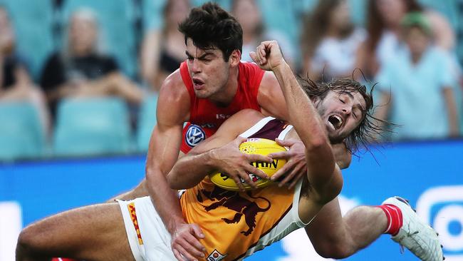 George Hewett puts the clamps on Brisbane’s Rhys Mathieson. Picture: Phil Hillyard