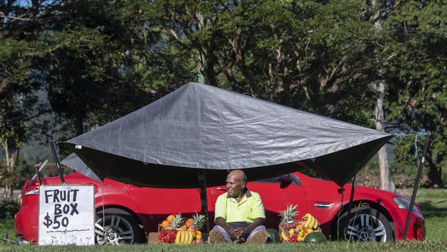 Torres Strait Islander Aviu Ned Ware at his roadside fruit stand. Picture: Brian Cassey