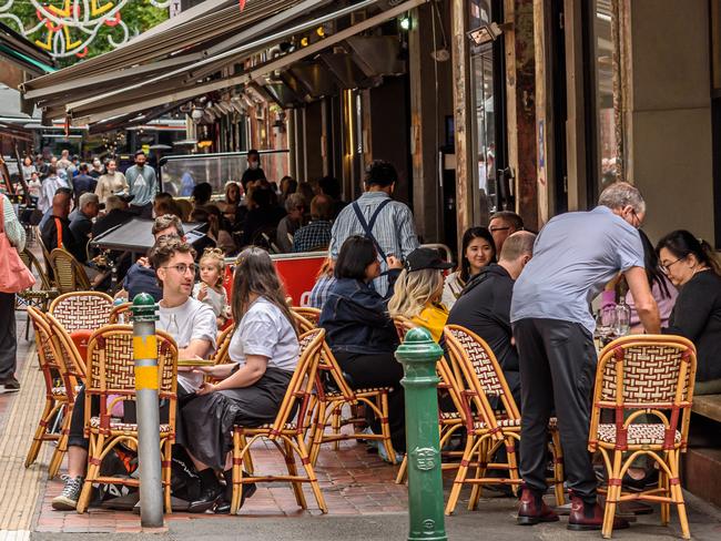 Melbourne, Victoria, Australia, December 11th, 2021: Hardware Lane in Melbourne, Australia is a popular tourist area filled with cafes and restaurants featuring outdoor dining.