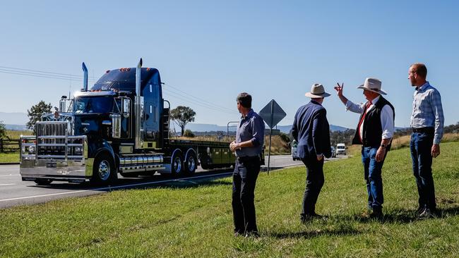 Deputy PM and New England MP Barnaby Joyce waves at a passing truck at Muswellbrook as he announces funding for the town's New England Highway bypass. Picture: Brad Hunter.