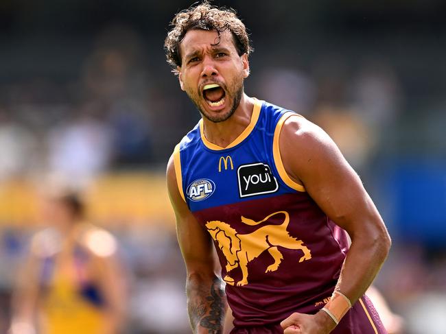 BRISBANE, AUSTRALIA - MARCH 23: Callum Ah Chee of the Lions celebrates kicking a goal during the round two AFL match between Brisbane Lions and West Coast Eagles at The Gabba, on March 23, 2025, in Brisbane, Australia. (Photo by Albert Perez/AFL Photos via Getty Images)