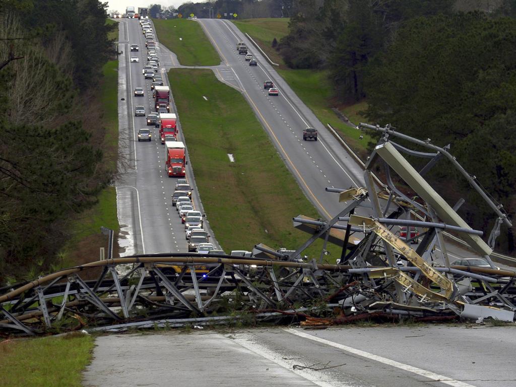 A fallen cell tower lies across US Route 280 highway in Lee County, Alabama. Picture: AP