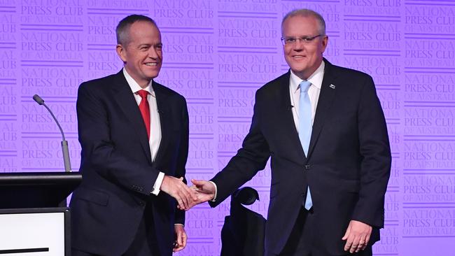 Bill Shorten and Scott Morrison shake hands before last night’s third leaders debate in Canberra. Picture: AAP