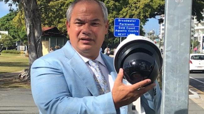 Mayor Tom Tate with a new security camera that is being installed as part of the Commowealth Games legacy.