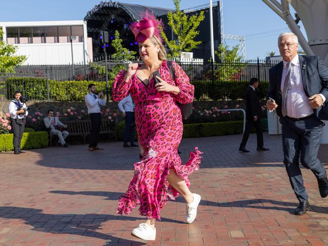 Punters sprint through the gates at Flemington. Picture: Jason Edwards