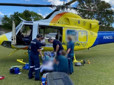 A man has been flown to hospital with "significant" head injuries after a wooden beam reportedly fell on him at Cooroy. Photo: RACQ LifeFlight Rescue