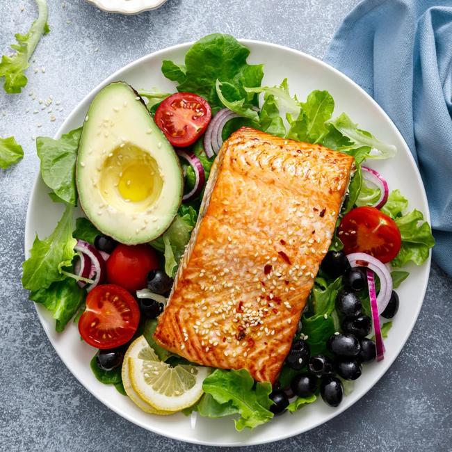 Good choices for evening meals include fish or lean meat. Picture: Getty Images