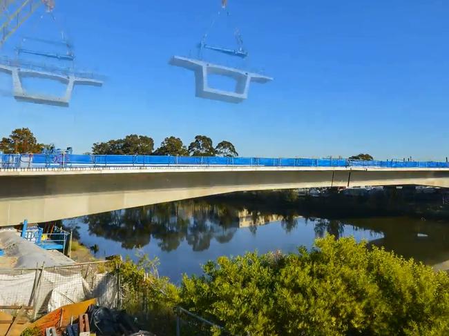 A 30 tonne beam has been craned into place completing the new Gardeners Road bridge.