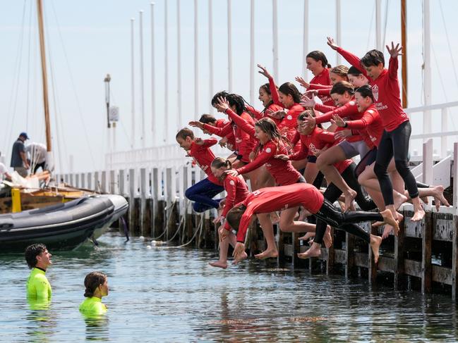 Jumping off the pier at Sorrento Sailing Couta Boat Club is all part of the fun for Sorrento Primary students. Picture Henry Yates.