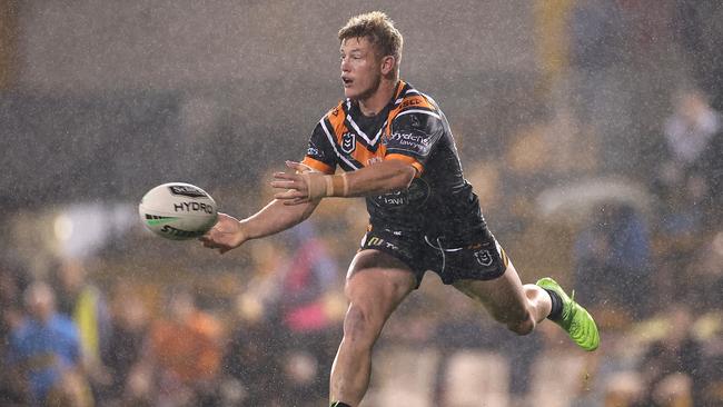 Harry Grant offloads against Brisbane Broncos at Leichhardt Oval last season. Picture: Getty Images