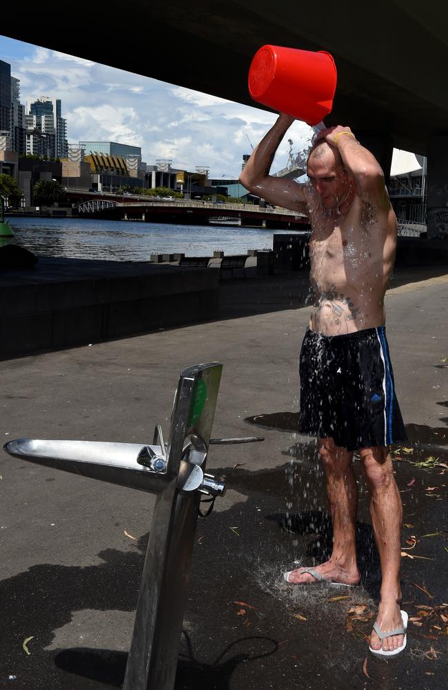 Jeremy, 34, has a wash at Enterprize Park in Melbourne. Picture: Nicole Garmston