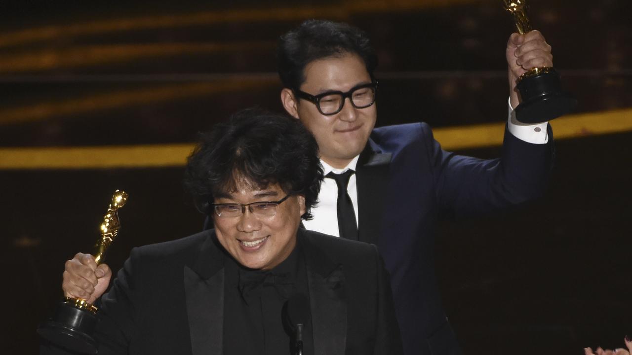 Best Original Screenplay:<i> Parasite</i>. Bong Joon Ho, left, and and Han Jin Won, right, accept the award. Picture: AP