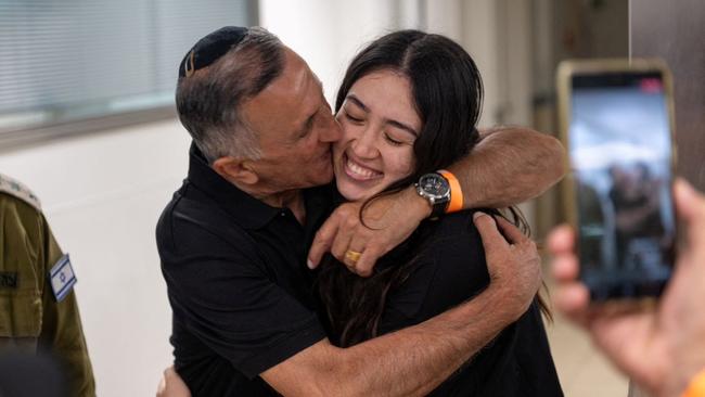 Noa Argamani, a rescued hostage embraces her father, Yakov Argamani, after the military said that Israeli forces have rescued four hostages alive from the central Gaza Strip. Picture: Reuters