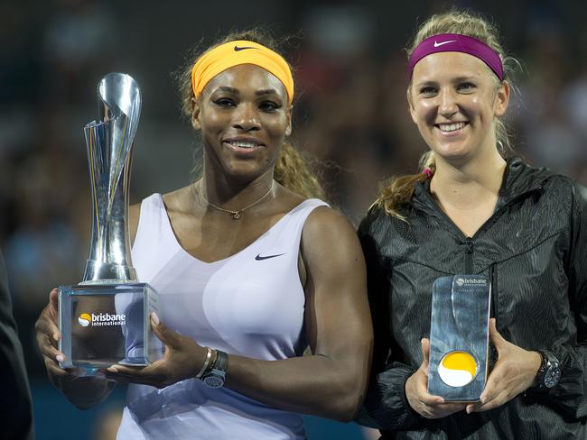 Serena Williams (left) celebrates her Brisbane International win 2014 alongside beaten finalist Victoria Azarenka. Picture: AAP Image/Dave Hunt