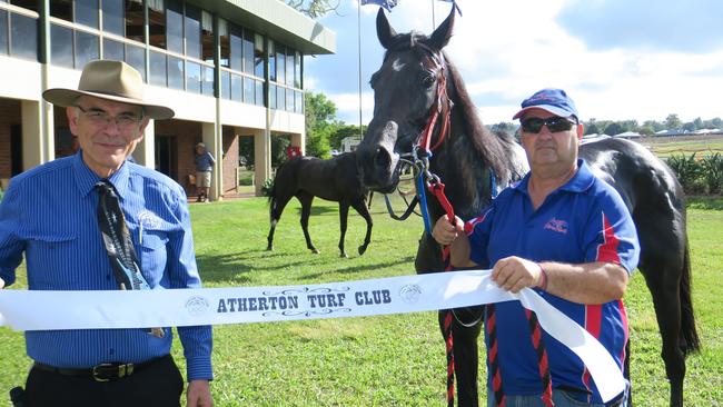 Joe Paronella presented the winning ribbon to trainer Steve Potiris after Linnet Moon had a stunning win in the Malanda Hotel Benchmark 50 Handicap over 1400m at Morrow Park on Saturday.