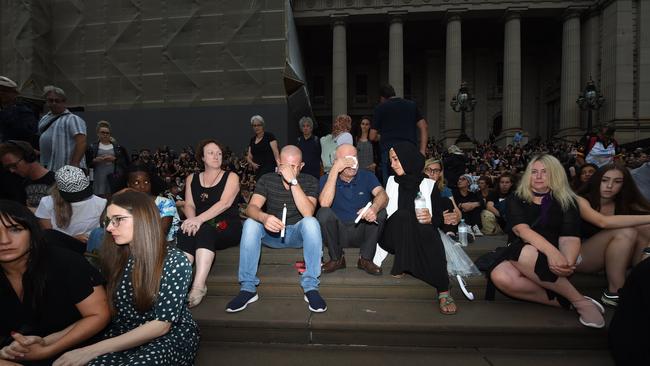 Ms Maasarwe’s father Saeed, centre, blue shirt, is consoled at the vigil. Picture: Tony Gough