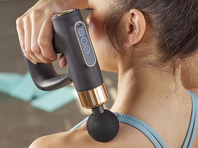 This massage gun is available at Coles for $59.99