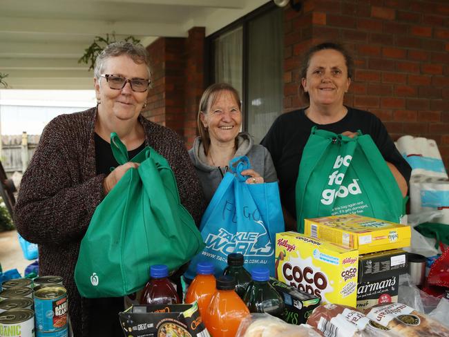 Fisherman’s Paradise residents Karen Hapgood, Dawn Nobes, and Donna Webb are helping get donated supplies to local families. The town was without power. Picture: David Swift