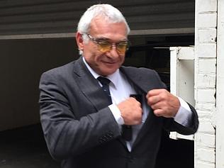 SA businessman Constantine (Con) Polites smoking cigar 14 Jan 1995.