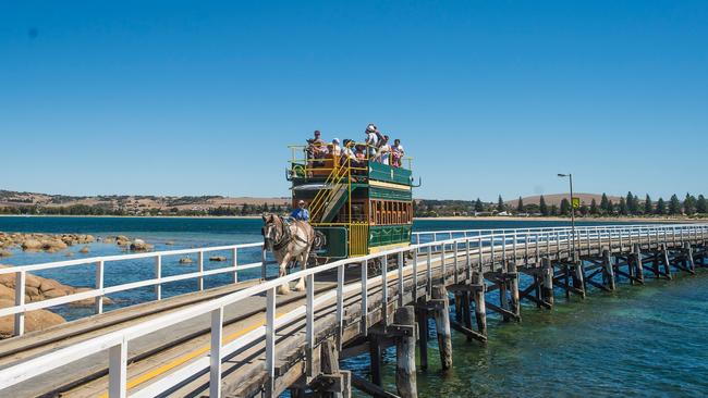 The horse-drawn tram on the causeway from Victor Harbor to Granite Island. Picture: South Australian Tourism Commission