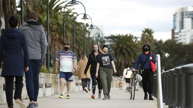 People on their hour of daily exercise in Port Melbourne. Picture: Daniel Pockett