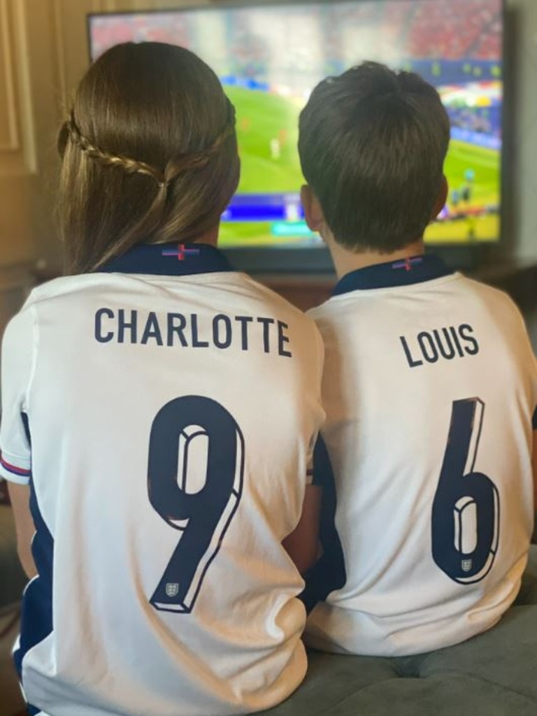 Charlotte and Louis watching the game.