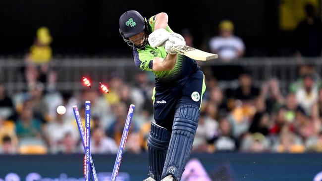 Curtis Campher of Ireland is clean bowled by Mitchell Starc. Photo by Bradley Kanaris/Getty Images