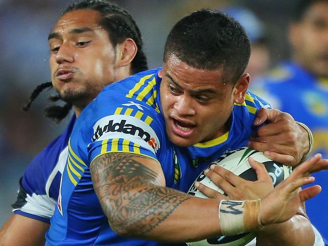 SYDNEY, AUSTRALIA - MARCH 14: Jacob Loko of the Eels is tackled by the Bulldogs defence during the round two NRL match between the Parramatta Eels and the Canterbury Bulldogs at ANZ Stadium on March 14, 2013 in Sydney, Australia. (Photo by Brendon Thorne/Getty Images)