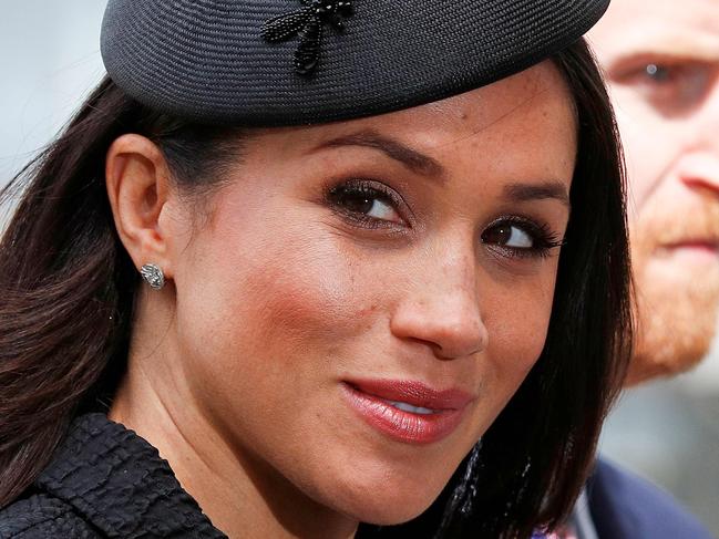 (FILES) In this file photo taken on April 25, 2018 Britain's Prince Harry (R) and his US fiancee Meghan Markle arrive to attend a service of commemoration and thanksgiving to mark Anzac Day in Westminster Abbey in London on April 25, 2018. - Meghan Markle has revealed she suffered a miscarriage in July this year, writing in the New York Times on November 25, 2020 of the deep grief and loss she endured with her husband Prince Harry. (Photo by Adrian DENNIS / AFP)