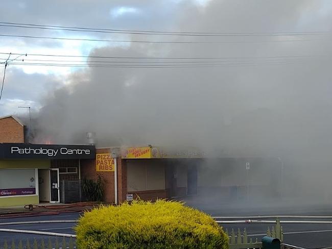 A large volume of smoke was seen coming out of the premises on Tuesday morning. Picture: Supplied