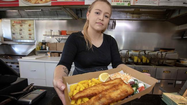 Teagan Williams serving fish and chips in Adelaide. Picture: Emma Brasier