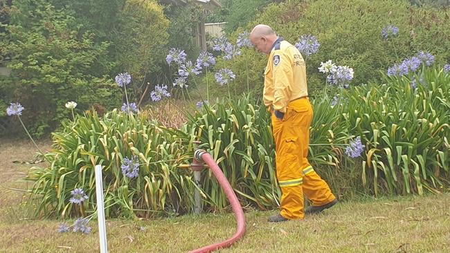 A Linden RFS crew member filling up during patrols of the L3 fire trail. Picture: Isabell Petrinic