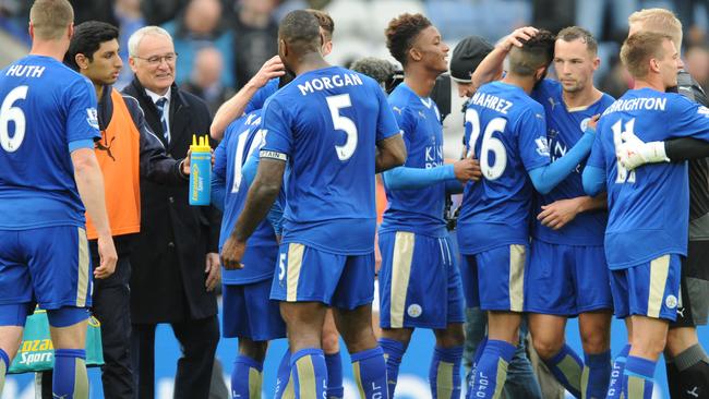 Leicester's manager Claudio Ranieri, 3rd left, celebrates with players.