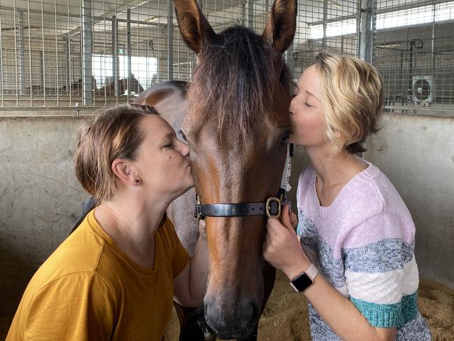 Tara Pitt (left) and Emma Lehmann with Alligator Blood yesterday, in a much more relaxed mode than they were when jammed in traffic trying to get to the races on Saturday.Picture: Supplied