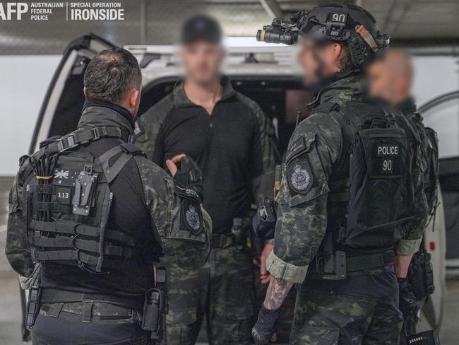 Heavily-armed police preparing to conduct searches as part of the Operation Ironside AN0M sting. Picture: AFP