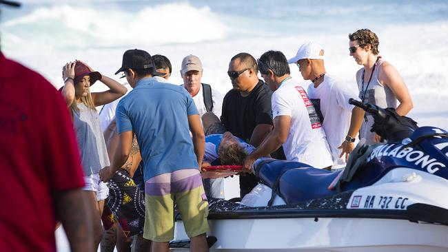 Bede Durbidge is pictured injured during a wipe-out in Round 3 at the Billabong Pipe Masters on Wednesday December 16, 2015.