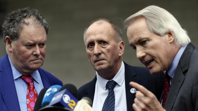 British cave explorer Vernon Unsworth, centre, with his attorneys, Mark Stephens, left, and Lin Wood.