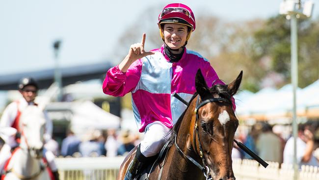 Jockey Michael Hellyer aboard Baccarat Baby at Doomben Racecourse in Brisbane, Saturday, September 15, 2018. Picture: AAP Image/Albert Perez