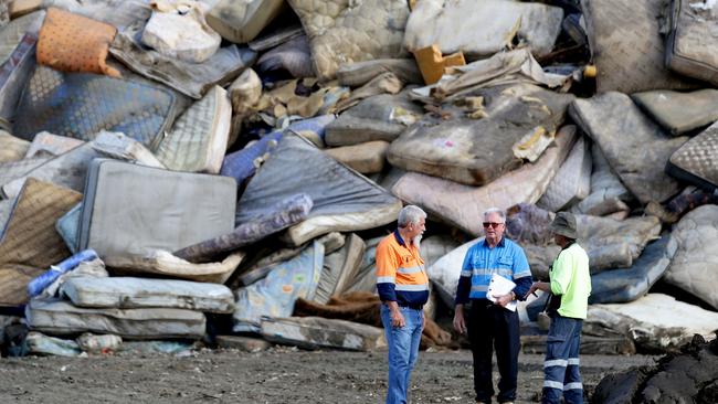 The clean-up effort began immediately after the disaster. Picture: Nathan Edwards