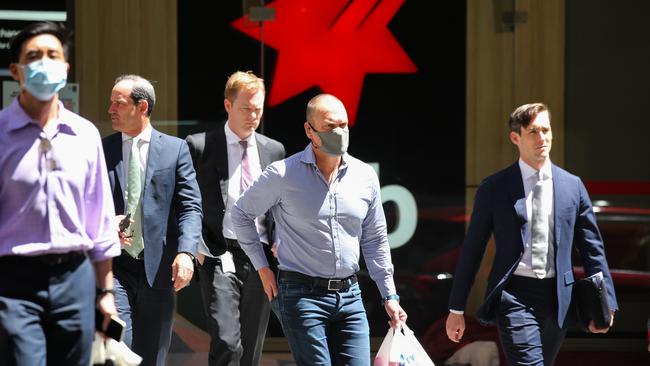 SYDNEY, AUSTRALIA - NewsWire Photos, NOVEMBER 16 2021:  Sydney siders are seen wearing suits as they walk down Pitt street at lunch time in the CBD, in Sydney. Picture: NCA Newswire / Gaye Gerard