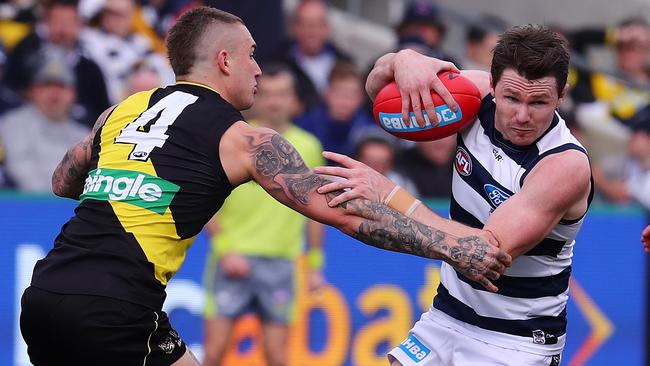 Patrick Dangerfield tries to break through the tackle of Dustin Martin. Picture: Michael Klein