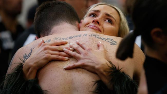 Jeremy Howe is consoled in the rooms after the Grand Final.