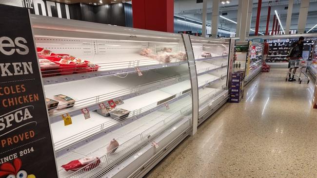 The shelves were emptied in the meat section of the Coles supermarket in Idalia. Picture: Chris McMahon.