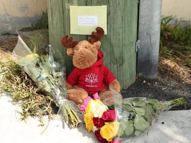 Pictured is a toy and some flowers left at the scene on Moorilla St in Dee Why, where Hane  Mathieson 58, was killed by a reversing Garbage Truck.