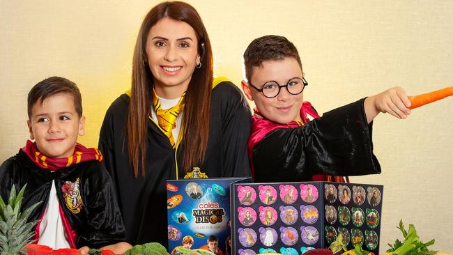 Coles has announced the launch of a new range of Harry Potter-themed collectables for shoppers who spend $30 or more in a single transaction. Zac and Issa enjoy the new range. Picture Rebecca Michael.