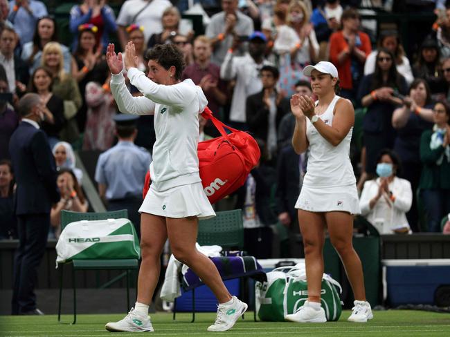 Spain's Carla Suarez Navarro (L) leaves the court after losing to Australia's Ashleigh Barty. Picture: AFP